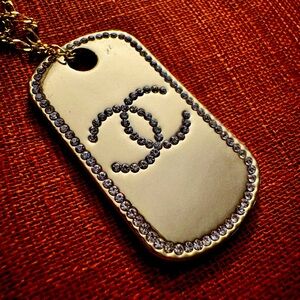 Chanel CC logo dog tag with chain.